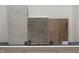 Selection of interior finishes including tile, carpet and wood flooring samples, with neutral, earthy tones at 8445 Morgan Ln, Zionsville, IN 46077