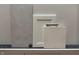 Selection of interior finishes including floor tile, cabinet and counter samples, with neutral tones at 8445 Morgan Ln, Zionsville, IN 46077