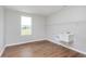 This laundry room boasts a utility sink, window, and shelving, making chores a breeze at 8445 Morgan Ln, Zionsville, IN 46077