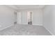 A spacious bedroom with a trey ceiling includes a bathroom and a walk-in closet at 8445 Morgan Ln, Zionsville, IN 46077