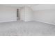This spacious room features carpet flooring, a large window, and neutral walls at 8445 Morgan Ln, Zionsville, IN 46077