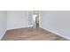 This spacious room has an open doorway, wood floors, and neutral walls at 8445 Morgan Ln, Zionsville, IN 46077