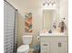 Neutral bathroom featuring a vanity with storage, framed mirror, and shower with curtain at 856 Parker Ln, Westfield, IN 46074