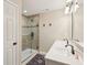 Modern bathroom with a double sink vanity, walk-in shower with glass door and tile surround at 856 Parker Ln, Westfield, IN 46074