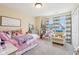 Cozy bedroom with cute decor, a large window, and a comfortable sitting area at 856 Parker Ln, Westfield, IN 46074