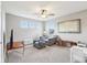 Cozy bonus room with comfortable seating, soft carpet, ample natural light, and neutral color scheme at 856 Parker Ln, Westfield, IN 46074
