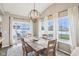 Dining area with hardwood floors, abundant natural light, and sliding glass doors to the backyard at 856 Parker Ln, Westfield, IN 46074