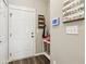 Entryway features a white door, drop zone, wall calendar, and laminate flooring at 856 Parker Ln, Westfield, IN 46074