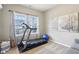 Cozy exercise room with large windows and a treadmill at 856 Parker Ln, Westfield, IN 46074