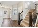 Welcoming foyer with wood floors, staircase, and elegant decor at 856 Parker Ln, Westfield, IN 46074