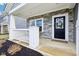 Inviting front porch with stone accents, white railings, and a welcoming front door at 856 Parker Ln, Westfield, IN 46074