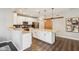 A spacious kitchen island is paired with white cabinetry and black subway tile backsplash at 856 Parker Ln, Westfield, IN 46074