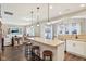 Spacious kitchen island with pendant lighting and stainless appliances, leading into the open-concept living area at 856 Parker Ln, Westfield, IN 46074