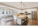 Open-concept kitchen with an island, granite countertops, stainless appliances, and a connected dining area at 856 Parker Ln, Westfield, IN 46074