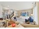 Open living room with plush sofas, staircase, and built-in entertainment center at 856 Parker Ln, Westfield, IN 46074