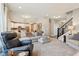 Spacious living room with open layout, staircase, and adjacent kitchen area at 856 Parker Ln, Westfield, IN 46074