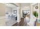 Open-concept living room with archway, hardwood floors, and plenty of natural light at 856 Parker Ln, Westfield, IN 46074