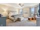 Spacious main bedroom with a king-size bed, plush carpeting, and comfortable sitting area at 856 Parker Ln, Westfield, IN 46074