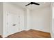 This bedroom features hardwood floors, white walls, baseboard trim, and a double closet at 1020 Calvary St, Indianapolis, IN 46203