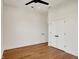 This bedroom features hardwood floors, white walls, and a double closet and entry door at 1020 Calvary St, Indianapolis, IN 46203