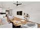 Open-concept living room with hardwood floors, stylish furniture, and views into the kitchen at 1020 Calvary St, Indianapolis, IN 46203