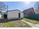Backyard view featuring a detached garage in a residential neighborhood at 1129 Church St, Indianapolis, IN 46225