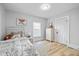 Bedroom featuring hardwood floors, neutral walls, with a view from the window at 1129 Church St, Indianapolis, IN 46225