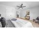 Cozy main bedroom featuring light walls, hardwood floors, and comfortable furnishings at 1129 Church St, Indianapolis, IN 46225