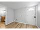 Room with neutral paint, hardwood floors and door leading to the bathroom at 1129 Church St, Indianapolis, IN 46225