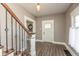 Inviting entryway with hardwood floors and a view of the stairs at 117 N Leland St, Fortville, IN 46040