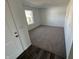 A bright bedroom with neutral carpet and fresh, white walls provides a cozy atmosphere at 1195 Andromeda Dr, Franklin, IN 46131