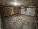 Spacious two-car garage with concrete flooring, unfinished walls, and an overhead door with automatic opener at 1195 Andromeda Dr, Franklin, IN 46131