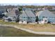 The aerial view shows the backyard of the blue houses with water access at 12561 Marina View Dr, Indianapolis, IN 46256