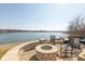 Beautiful backyard overlooking the water includes a gas firepit and outdoor seating at 12561 Marina View Dr, Indianapolis, IN 46256