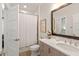 This bathroom has a shower/tub combination, a single vanity and a large mirror at 12561 Marina View Dr, Indianapolis, IN 46256