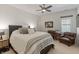 This bedroom features natural light, neutral paint, and comfortable chairs for relaxing at 12561 Marina View Dr, Indianapolis, IN 46256