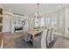 Cozy dining area with rustic wood table, chandelier, and comfortable seating at 12561 Marina View Dr, Indianapolis, IN 46256