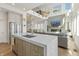 Gourmet kitchen with a large island, stainless steel appliances, and open view to the living room at 12561 Marina View Dr, Indianapolis, IN 46256