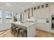 Well-equipped kitchen features a breakfast bar, stainless steel appliances, and lake views at 12561 Marina View Dr, Indianapolis, IN 46256