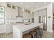 Beautiful, bright kitchen with island seating, stainless appliances, and modern finishes and fixtures at 12561 Marina View Dr, Indianapolis, IN 46256