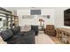 Comfortable sectional sofa and leopard print chair are placed around a lovely area rug in a brightly-lit living room at 12561 Marina View Dr, Indianapolis, IN 46256