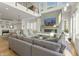 Bright and airy living room featuring a stone fireplace and a comfortable sectional sofa at 12561 Marina View Dr, Indianapolis, IN 46256