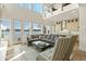 Spacious living room boasts soaring ceilings, lake views, and a seamless flow into the gourmet kitchen at 12561 Marina View Dr, Indianapolis, IN 46256