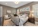 Serene main bedroom with neutral decor, a cozy sitting area, and plenty of natural light at 12561 Marina View Dr, Indianapolis, IN 46256