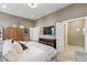 This main bedroom features neutral paint and a well-appointed ensuite bath with a glass shower at 12561 Marina View Dr, Indianapolis, IN 46256