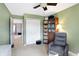 Green painted bedroom with closet and ceiling fan at 12635 Braddock Ln, Noblesville, IN 46060