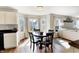 Cozy dining area with hardwood floors and large windows, providing ample natural light and a great view at 12635 Braddock Ln, Noblesville, IN 46060