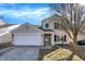 Charming two-story home featuring a two-car garage and manicured front yard, perfect for Gathering living at 12635 Braddock Ln, Noblesville, IN 46060