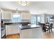 Bright kitchen boasts modern appliances, white cabinetry, and an open layout to the dining area at 12635 Braddock Ln, Noblesville, IN 46060