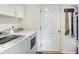 Convenient laundry room with washer, dryer, and extra storage space at 12635 Braddock Ln, Noblesville, IN 46060